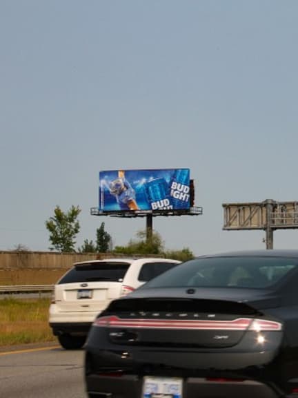 highway billboard out of home advertising in detroit for bud light