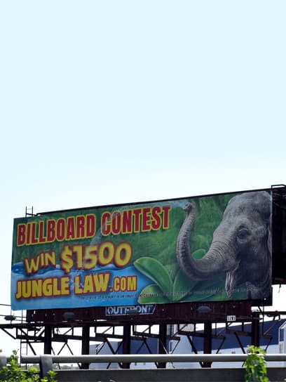 out of home advertising jungle law billboard